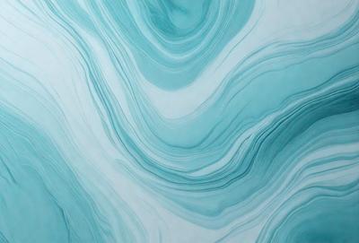 The primary subject of the image is a blue and white ocean wave. The setting is the ocean, with the wave rolling in. The visual style is a photo of the ocean, capturing the beauty of the waves. The dominant colors are blue and white, creating a serene and calming atmosphere.