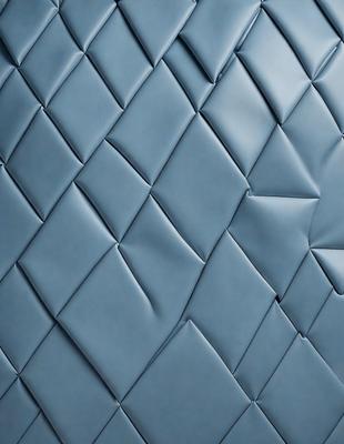 The primary subject of the image is a blue, textured wall with a patterned design. The setting is a room with a blue wall, and the visual style appears to be a photo. The dominant colors are blue and white, creating a calm and soothing atmosphere.