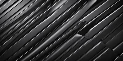 The primary subject of the image is a close-up of a black and silver metal surface. The setting is a dark room, and the visual style appears to be a photo. The dominant colors are black and silver, creating a sleek and modern atmosphere.
