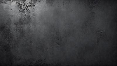 The primary subject of the image is a gray, textured wall. The setting is a dark room, and the visual style is a close-up of the wall. The colors and mood of the image are predominantly dark and moody, with the gray wall being the main focus.