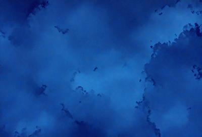 The primary subject of the image is a blue sky filled with clouds. The setting is a cloudy day, and the visual style is a photo. The dominant colors are blue and white, creating a calm and serene atmosphere.