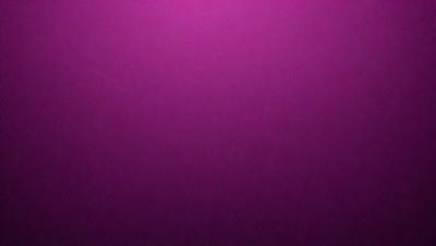 The primary subject of the image is a purple wall. The setting is a room with a purple wall, and the visual style is a close-up of the wall. The dominant colors are purple, and the overall atmosphere is calm and serene.