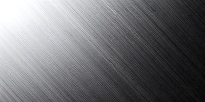 The primary subject of the image is a close-up of a shiny metal surface, possibly a silver or stainless steel surface. The setting is a black background, which contrasts with the shiny metal surface. The visual style appears to be a photo or a close-up of a metal surface. The colors in the image are predominantly silver and black, creating a sleek and modern atmosphere.