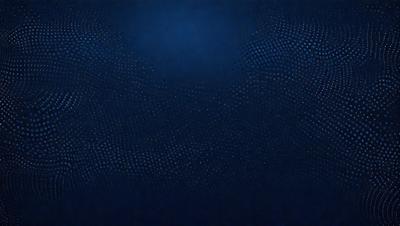 The primary subject of the image is a blue background with a pattern of small circles. The setting appears to be a dark room, and the visual style is a close-up of the blue background. The dominant colors are blue and black, creating a calm and serene atmosphere.