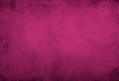 The primary subject of the image is a large, pink wall. The setting is a room with a pink background, and the visual style is a close-up of the wall. The dominant colors are pink, and the overall atmosphere is warm and inviting.