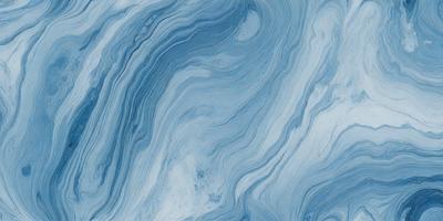 The primary subject of the image is a blue and white marbled tile. The setting is a bathroom, as indicated by the presence of the marbled tile. The visual style is a close-up of the tile, showcasing its intricate design. The dominant colors are blue and white, creating a calm and soothing atmosphere.
