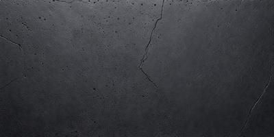 The primary subject of the image is a concrete wall with a crack in it. The setting is an outdoor environment, and the visual style is a black and white photo. The colors and mood of the image are dark and moody, with the crack in the concrete adding a sense of imperfection to the scene.