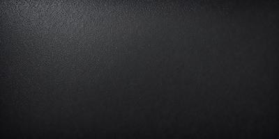 The primary subject of the image is a black leather surface. The setting is a black background, which creates a striking contrast with the leather. The visual style is a close-up of the leather, emphasizing its texture and appearance. The colors and mood of the image are predominantly dark, with the black leather and background creating a moody and dramatic atmosphere.