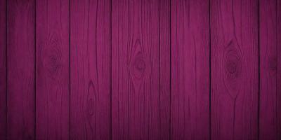 The primary subject of the image is a wooden wall with a purple color. The setting is a room with a wooden floor. The visual style is a close-up of the wooden wall, showcasing its texture and color. The dominant colors are purple and brown, creating a warm and cozy atmosphere.