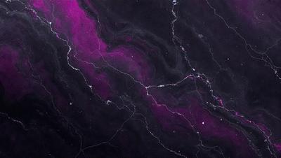 The primary subject of the image is a purple and black marbled stone wall. The setting is a dark room with a purple and black marbled stone wall as the main focus. The visual style is a close-up of the marbled stone wall, showcasing its unique texture and pattern. The colors and mood of the image are predominantly purple and black, creating a moody and dramatic atmosphere.