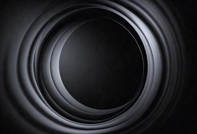 The primary subject of the image is a black hole, which is the main object, scene, or focus of the image. The setting/background consists of a black background, which creates a dramatic and mysterious atmosphere. The visual style of the image is a close-up shot of the black hole, which emphasizes its depth and intricacy. The colors and mood of the image are predominantly dark and moody, with the black hole being the central point of interest.