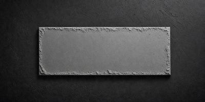 The primary subject of the image is a large, gray, concrete block. The setting is a dark, possibly black, background. The visual style appears to be a photo of the concrete block. The colors and mood of the image are dark and moody, with the concrete block being the main focus.
