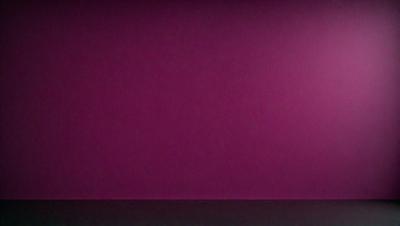 The primary subject of the image is a large, pink wall. The setting is a room with a pink background, and the visual style is a photo. The dominant colors in the image are pink, and the overall atmosphere is warm and inviting.