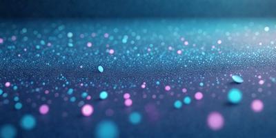 The primary subject of the image is a blue surface with a pattern of blue and pink dots. The setting appears to be a dark room, and the visual style is a close-up of the blue surface. The colors and mood of the image are predominantly blue and pink, creating a calm and soothing atmosphere.
