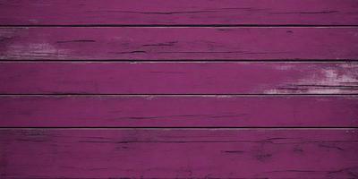 The primary subject of the image is a purple wooden wall. The setting is a room with a purple wall, and the visual style is a photo. The dominant colors are purple and pink, creating a warm and inviting atmosphere.