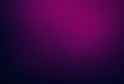 The primary subject of the image is a purple background. The setting is a dark, purple-colored room. The visual style is a close-up of the purple wall, which gives a sense of depth and texture. The colors and mood of the image are predominantly purple, creating a calm and serene atmosphere.