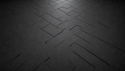 The primary subject of the image is a black and white floor, which appears to be a tile floor. The setting is a room with a black background, giving the image a stark and minimalist appearance. The visual style is a close-up of the floor, showcasing the intricate pattern of the tiles. The colors and mood of the image are predominantly black and white, creating a sense of depth and contrast.