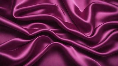 The primary subject of the image is a purple fabric, which is the main object, scene, or focus of the image. The setting or background is a purple fabric, and the visual style is a photo. The colors and mood of the image are predominantly purple, creating a calm and soothing atmosphere.