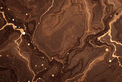 The primary subject of the image is a marble countertop with a brown and black color scheme. The setting is a kitchen, and the visual style is a close-up of the marble countertop. The countertop has a patterned texture, and the colors and mood suggest a warm and natural atmosphere.