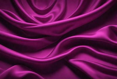 The primary subject of the image is a purple fabric, which is the main object, scene, or focus of the image. The setting or background is a purple curtain, and the visual style is a photo. The colors and mood of the image are predominantly purple, creating a calm and serene atmosphere.