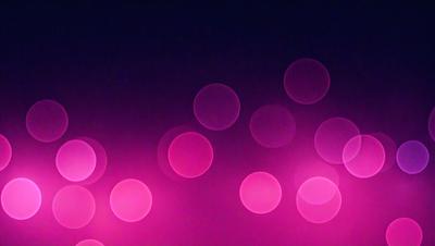 The primary subject of the image is a pattern of pink circles. The setting is a dark background, which contrasts with the bright pink circles. The visual style appears to be a digital art or illustration, as the circles are evenly spaced and have a consistent appearance. The dominant colors are pink, creating a warm and inviting atmosphere.
