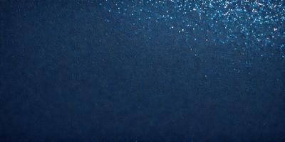The primary subject of the image is a blue sky with a few stars visible. The setting is a dark blue background, which contrasts with the brightness of the stars. The visual style is a combination of a photo and digital art, creating a unique and captivating scene. The colors and mood of the image are predominantly dark and moody, with the blue sky and stars providing a sense of depth and tranquility.
