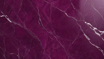 The primary subject of the image is a purple marble wall. The setting is a room with a purple marble wall as the main focus. The visual style is a close-up of the marble wall, showcasing its texture and color. The colors and mood of the image are predominantly purple, creating a calm and elegant atmosphere.