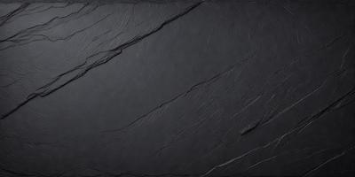 The primary subject of the image is a black surface, possibly a wall or a piece of artwork. The setting is a dark room, and the visual style appears to be a close-up of the black surface. The colors and mood of the image are predominantly dark and moody, with the black surface being the main focus.