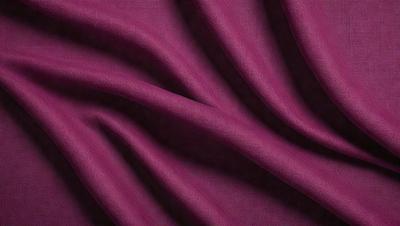 The primary subject of the image is a purple fabric, which is the main object, scene, or focus of the image. The setting or background is a purple curtain, and the visual style is a close-up of the fabric. The colors and mood of the image are predominantly purple, creating a calm and serene atmosphere.