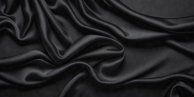 The primary subject of the image is a close-up of a black fabric, possibly a piece of clothing or a curtain. The setting is a dark background, which emphasizes the fabric's texture and color. The visual style appears to be a close-up or a detailed view of the fabric. The colors and mood of the image are predominantly dark, with the black fabric being the main focus.