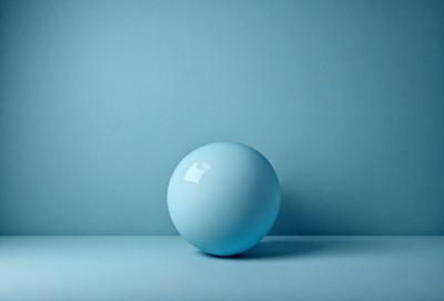 The primary subject of the image is a blue sphere, which is the main object in the scene. The setting is a blue wall, providing a contrasting background. The visual style is a photo, capturing the blue sphere in its natural environment. The colors and mood of the image are predominantly blue, creating a calm and serene atmosphere.