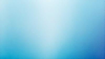 The primary subject of the image is a large, empty, and blue sky. The setting is a vast, open space with no visible landmarks or objects. The visual style is a natural, outdoor scene with a sense of tranquility and openness. The colors and mood are predominantly blue, creating a calm and serene atmosphere.
