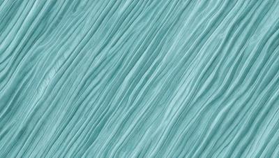 The primary subject of the image is a blue, wavy surface that resembles a piece of fabric or a water-like texture. The setting is a blue background, which complements the blue surface. The visual style is a close-up of the blue surface, showcasing its intricate details. The colors and mood of the image are predominantly blue, creating a calm and serene atmosphere.