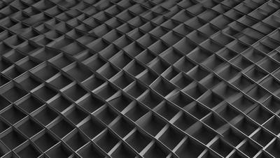 The primary subject of the image is a black and white pattern of a honeycomb-like structure. The setting is a black background, which contrasts with the pattern. The visual style is a close-up of the pattern, showcasing the intricate details of the honeycomb. The colors and mood of the image are predominantly black and white, giving it a classic and timeless appearance.