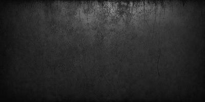 The primary subject of the image is a black and white photo of a wall. The setting is a room with a wall that has a black and white texture. The visual style is a black and white photograph, which gives the image a classic and timeless appearance. The colors and mood of the image are predominantly black and white, creating a sense of depth and contrast.