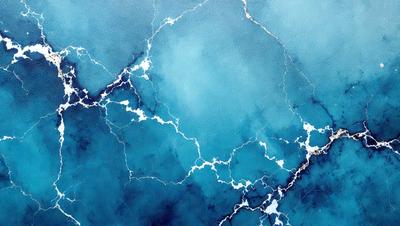 The primary subject of the image is a blue ocean with white and blue waves. The setting is the ocean, and the visual style is a photo. The dominant colors are blue and white, creating a serene and calming atmosphere.
