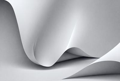 The primary subject of the image is a large sheet of white paper. The paper is folded and creased in various ways, creating a complex and intricate pattern. The setting is a white background, which highlights the paper's texture and creases. The visual style is a close-up of the paper, showcasing its details and texture. The colors and mood of the image are predominantly white, giving it a clean and minimalist appearance.