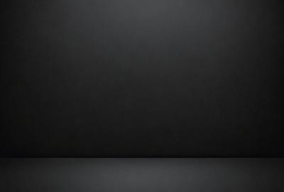 The primary subject of the image is a black background. The setting is a dark room, and the visual style is a black and white photo. The colors and mood are dark and moody, creating a sense of mystery or drama.