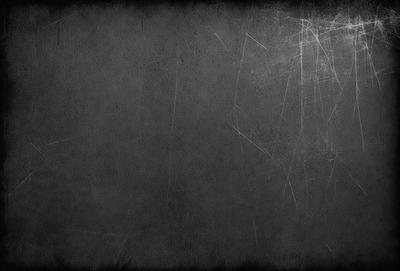 The primary subject of the image is a gray wall with a texture that appears to be a combination of a brick wall and a concrete wall. The setting is a room with a gray background, and the visual style is a close-up of the gray wall. The colors and mood of the image are predominantly gray, giving it a somewhat dull and monotonous appearance.