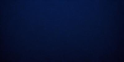 The primary subject of the image is a large, dark blue surface. The setting is a vast, open space with no visible objects or people. The visual style is a simple, monochromatic design, with no additional elements or textures. The colors and mood of the image are predominantly dark and moody, creating a sense of depth and mystery.