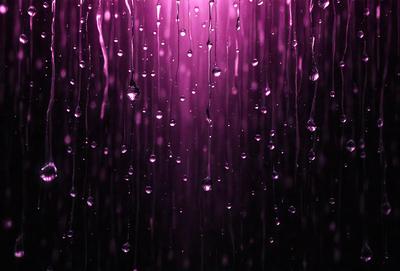 The primary subject of the image is a purple shower curtain with water droplets falling on it. The setting is a shower area, and the visual style is a close-up of the shower curtain. The colors and mood of the image are predominantly purple, creating a calming and soothing atmosphere.