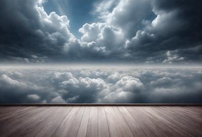 The primary subject of the image is a wooden deck with a railing. The setting is a cloudy sky, and the visual style is a photo. The dominant colors are shades of gray and white, creating a moody atmosphere.