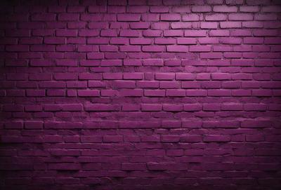 The primary subject of the image is a purple brick wall. The setting is a brick wall, and the visual style is a photo. The dominant colors are purple and pink, creating a warm and inviting atmosphere.