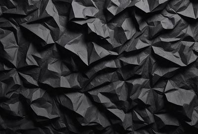 The primary subject of the image is a black wall with a pattern of black and white triangles. The setting is a dark room, and the visual style appears to be a digital art or illustration. The dominant colors are black and white, creating a bold and striking pattern on the wall.