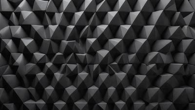 The primary subject of the image is a wall with a pattern of triangles. The setting is a black wall, and the visual style appears to be a pattern or texture. The dominant colors are black and white, creating a simple and clean appearance.