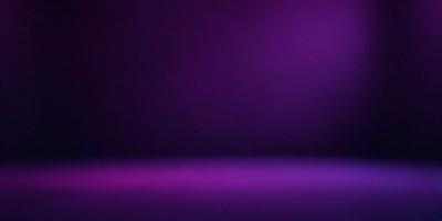 The primary subject of the image is a purple wall. The setting is a dark room with a purple background. The visual style is a photo, and the dominant colors are purple and black. The overall atmosphere is moody and dramatic.