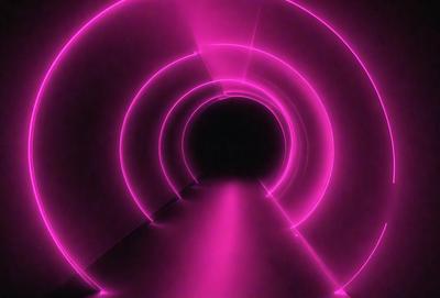 The primary subject of the image is a tunnel with a pink light illuminating it. The setting is a dark room, and the visual style appears to be a digital art or illustration. The dominant colors in the image are pink and purple, creating a warm and inviting atmosphere.