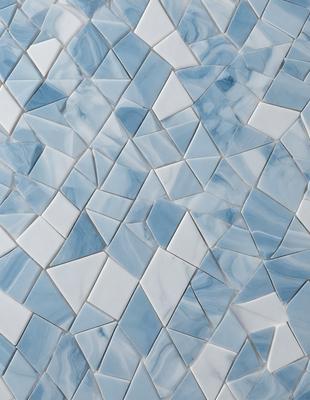 The primary subject of the image is a blue and white tile wall. The setting is a room with a blue and white tile backdrop. The visual style is a patterned tile wall, which gives the image a unique and artistic appearance. The dominant colors are blue and white, creating a calm and soothing atmosphere.