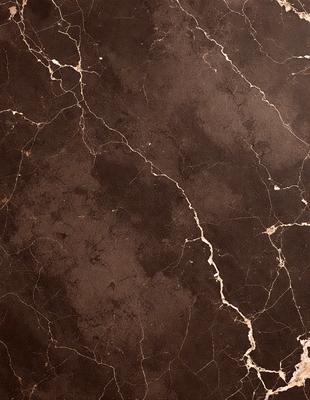 The image features a marble wall with a brown and white pattern. The wall appears to be textured and has a slightly rough surface. The primary subject of the image is the marble wall, which serves as the main object, scene, or focus of the image. The setting or background of the image is the marble wall, which is the primary visual element in the scene. The visual style of the image is a close-up of the marble wall, showcasing its texture and pattern. The colors and mood of the