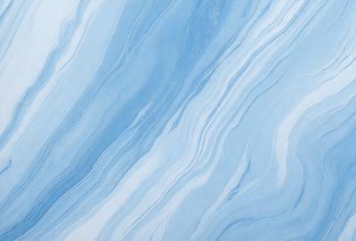 The primary subject of the image is a blue and white marbled wall. The setting is a room with a blue and white marbled wall as the main focus. The visual style is a photo of the marbled wall. The dominant colors are blue and white, creating a calm and soothing atmosphere.
